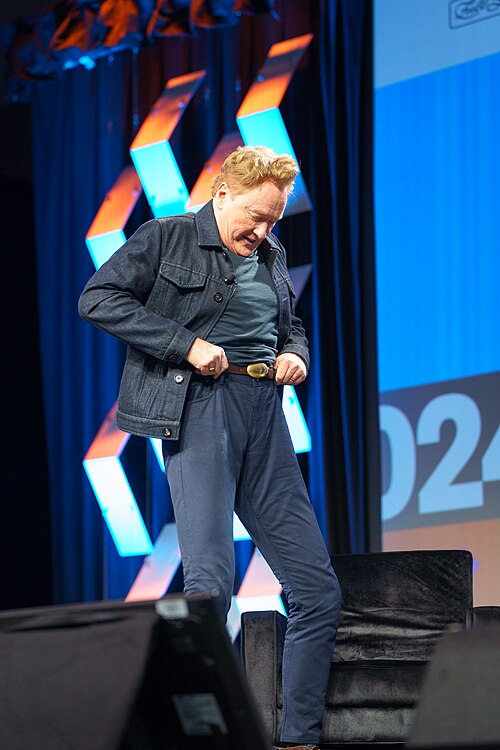 At Southwest 2024, Conan O'Brien demonstrates his disproportionately long legs