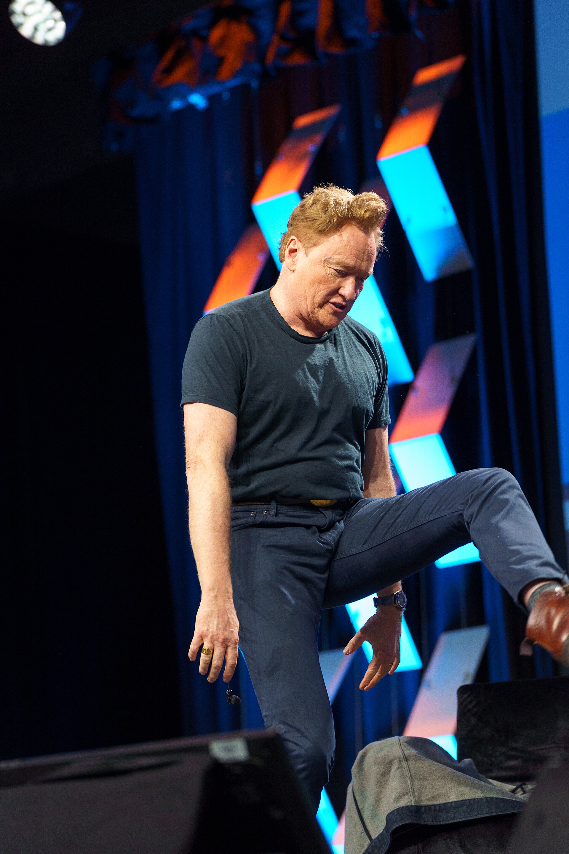 At Southwest 2024, Conan O'Brien demonstrates his disproportionately long legs
