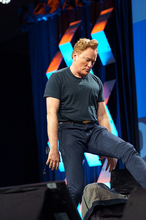 At Southwest 2024, Conan O'Brien demonstrates his disproportionately long legs