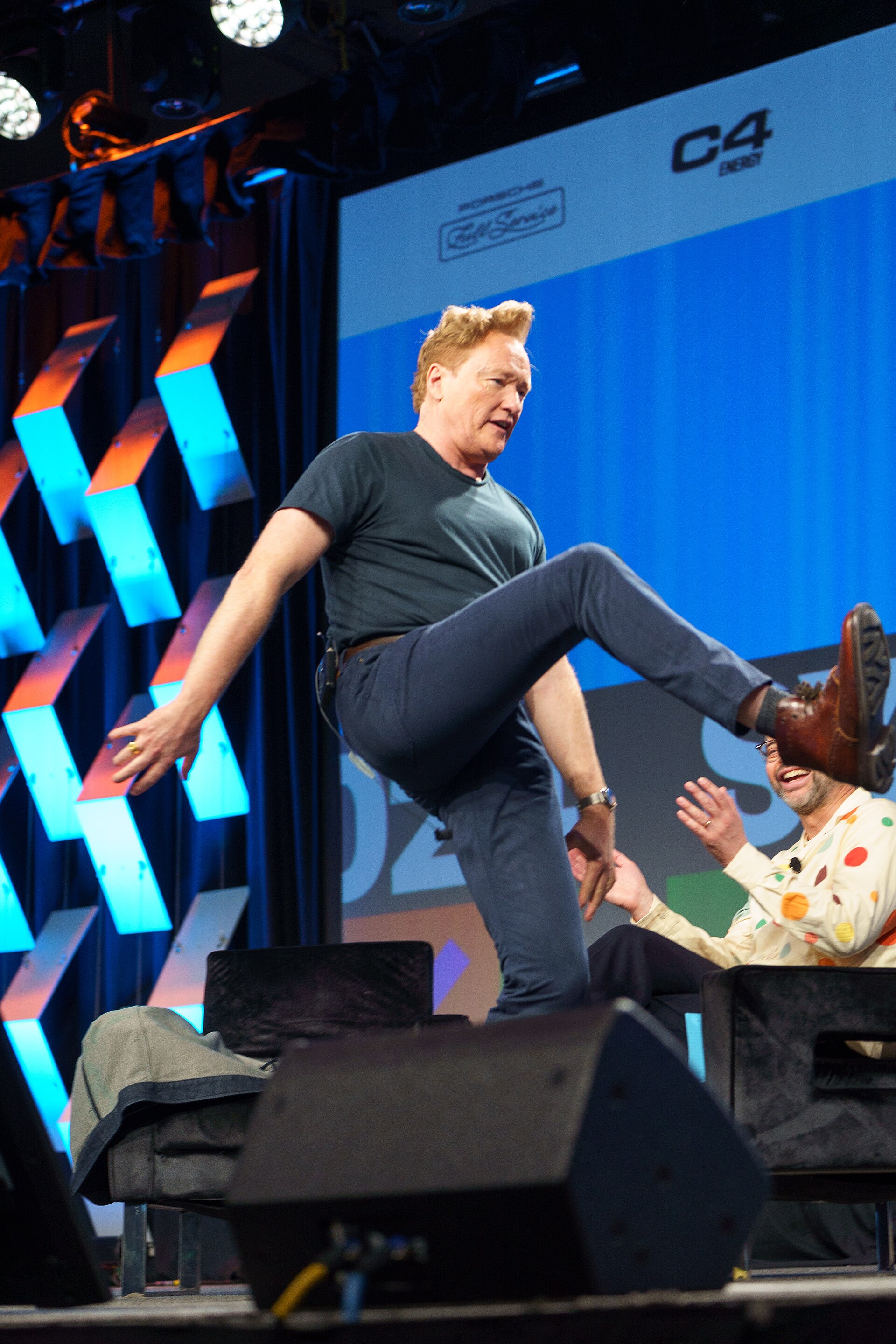 At Southwest 2024, Conan O'Brien demonstrates his disproportionately long legs