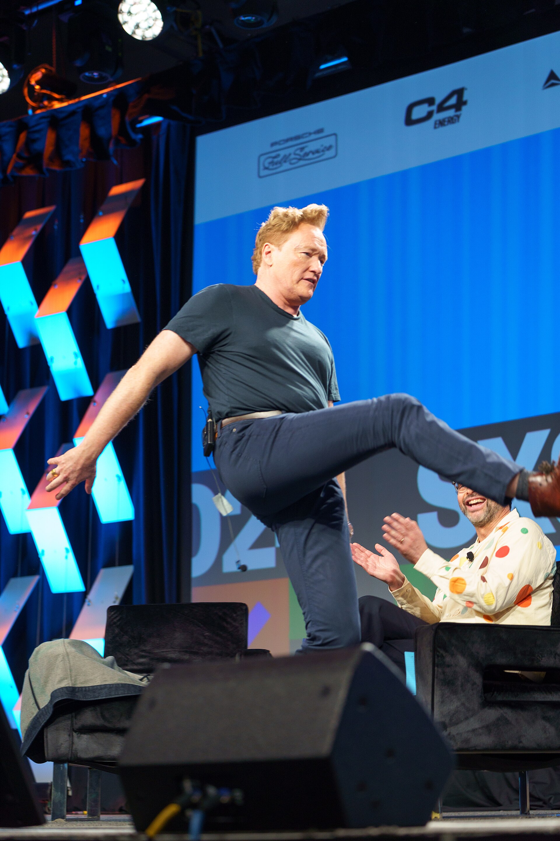 At Southwest 2024, Conan O'Brien demonstrates his disproportionately long legs