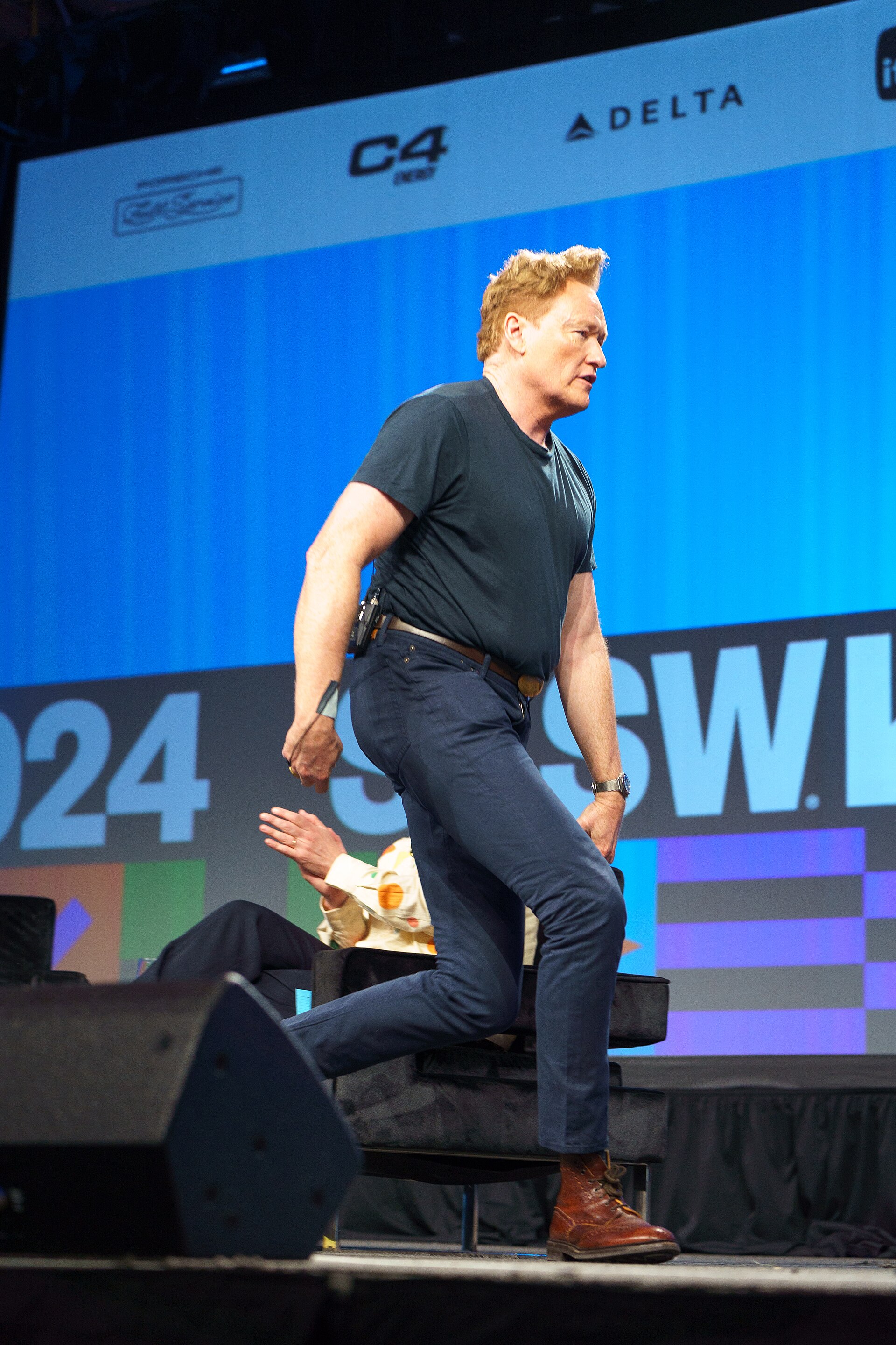 At Southwest 2024, Conan O'Brien demonstrates his disproportionately long legs