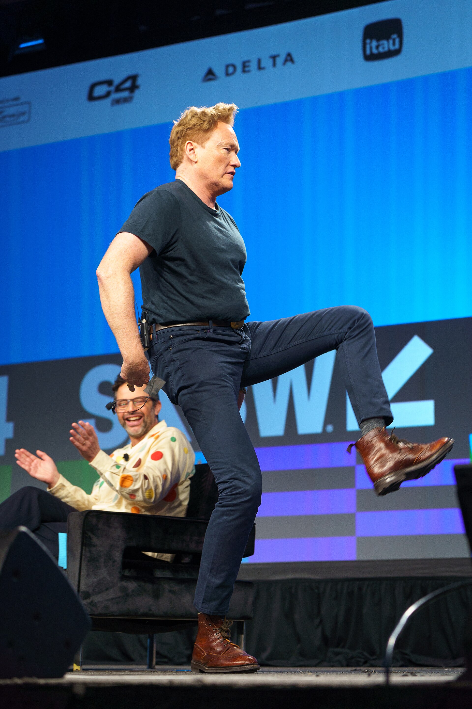 At Southwest 2024, Conan O'Brien demonstrates his disproportionately long legs