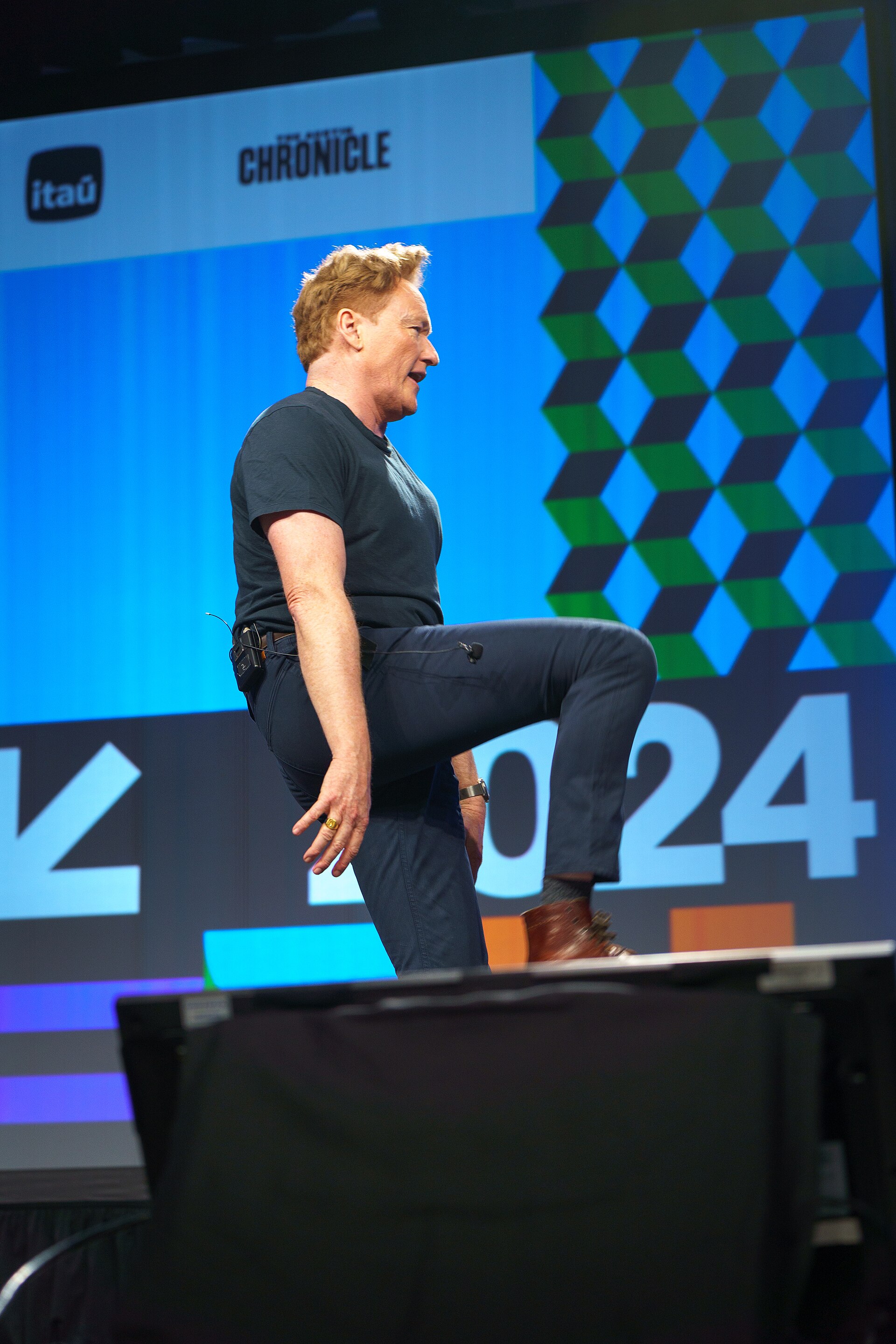 At Southwest 2024, Conan O'Brien demonstrates his disproportionately long legs