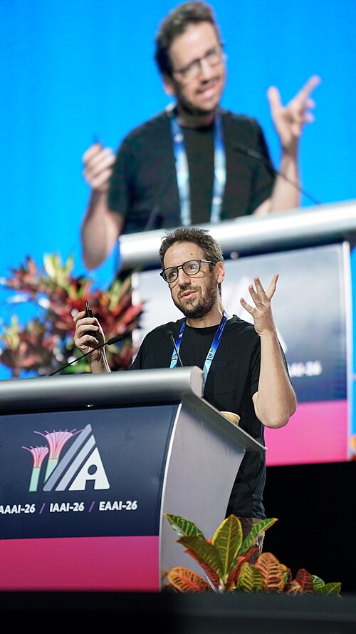 Daniel Whiteson at AAAI 2026 in Singapore for invited talk "Fundamental physics and science communication"
