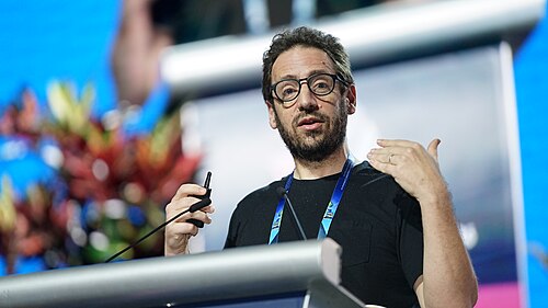 Daniel Whiteson at AAAI 2026 in Singapore for invited talk "Fundamental physics and science communication"