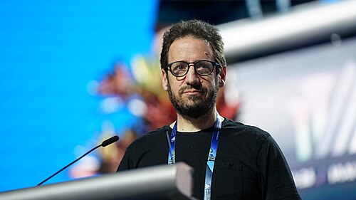 Daniel Whiteson at AAAI 2026 in Singapore for invited talk "Fundamental physics and science communication"