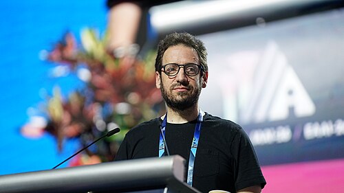 Daniel Whiteson at AAAI 2026 in Singapore for invited talk "Fundamental physics and science communication"