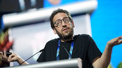 Daniel Whiteson at AAAI 2026 in Singapore for invited talk "Fundamental physics and science communication"