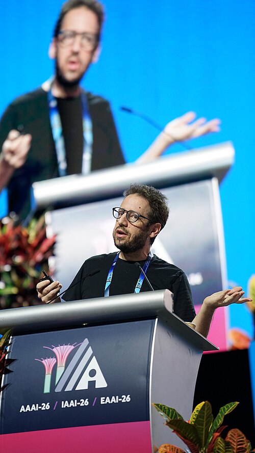 Daniel Whiteson at AAAI 2026 in Singapore for invited talk "Fundamental physics and science communication"
