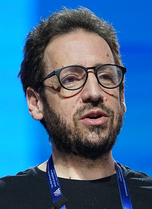 Daniel Whiteson at AAAI 2026 in Singapore for invited talk "Fundamental physics and science communication"