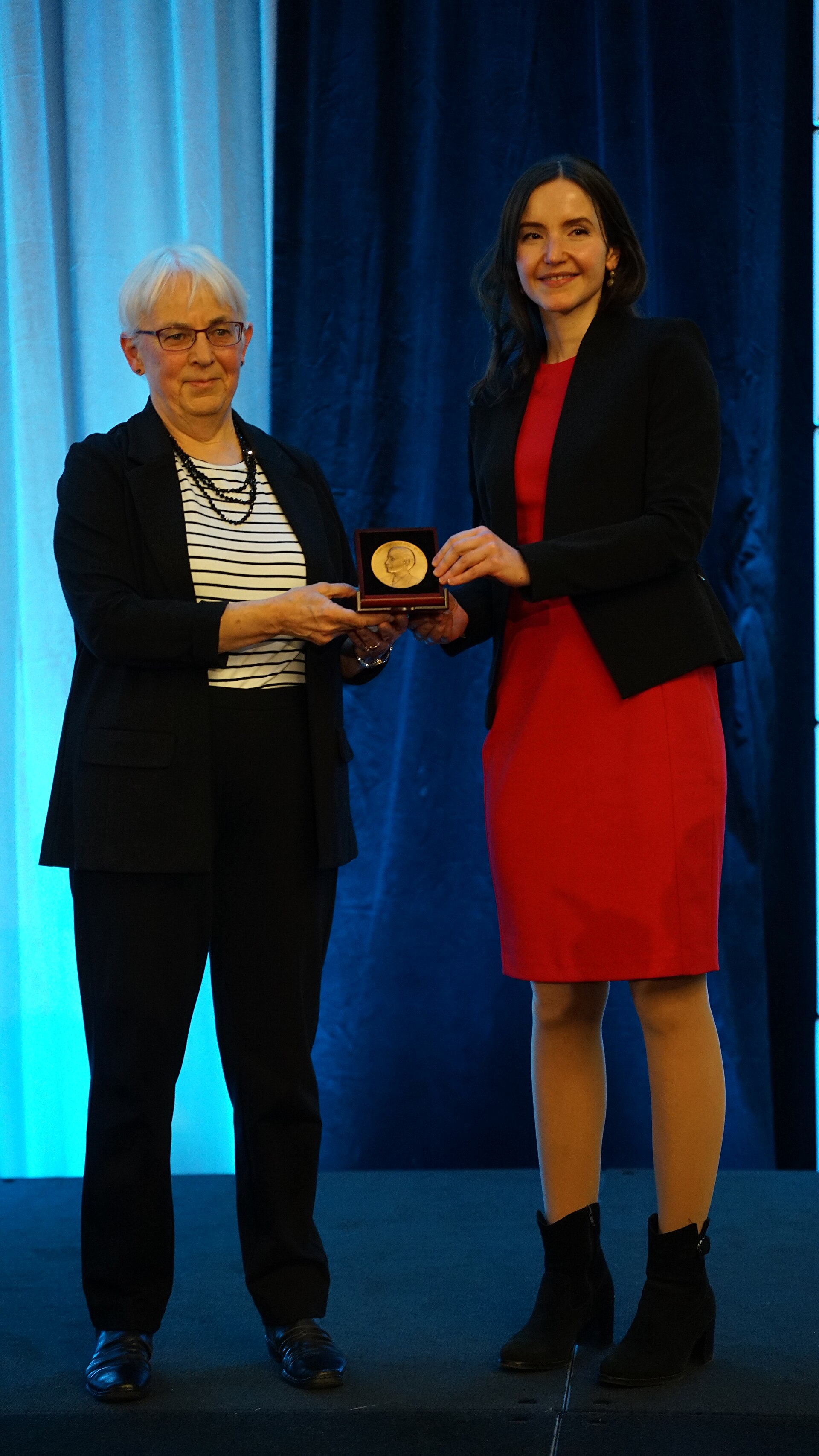Stefanie Stantcheva being awarded the John Bates Clark Medal by Katharine Abraham at the ASSA (AEA) Annual Meeting 2026 in Philadelphia, PA
