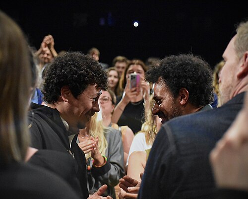 Across the Sea premiere at 2024 Cannes Film Festival Critics Week with director Saïd Hamich Benlarbi (right) and actor Ayoub Gretaa (left).