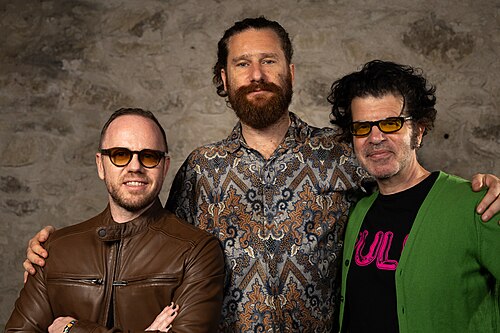 Alan R. Milligan, Jake Wachtel, and Daniel Raymont at the WikiPortraits studio at the 2025 SXSW Festival.
