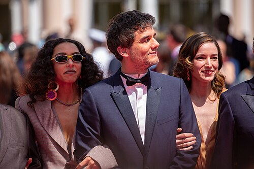 Alice Carvalho, Wagner Moura, and Emilie Lesclaux at 2025 Cannes Red Carpet for O Agente Secreto