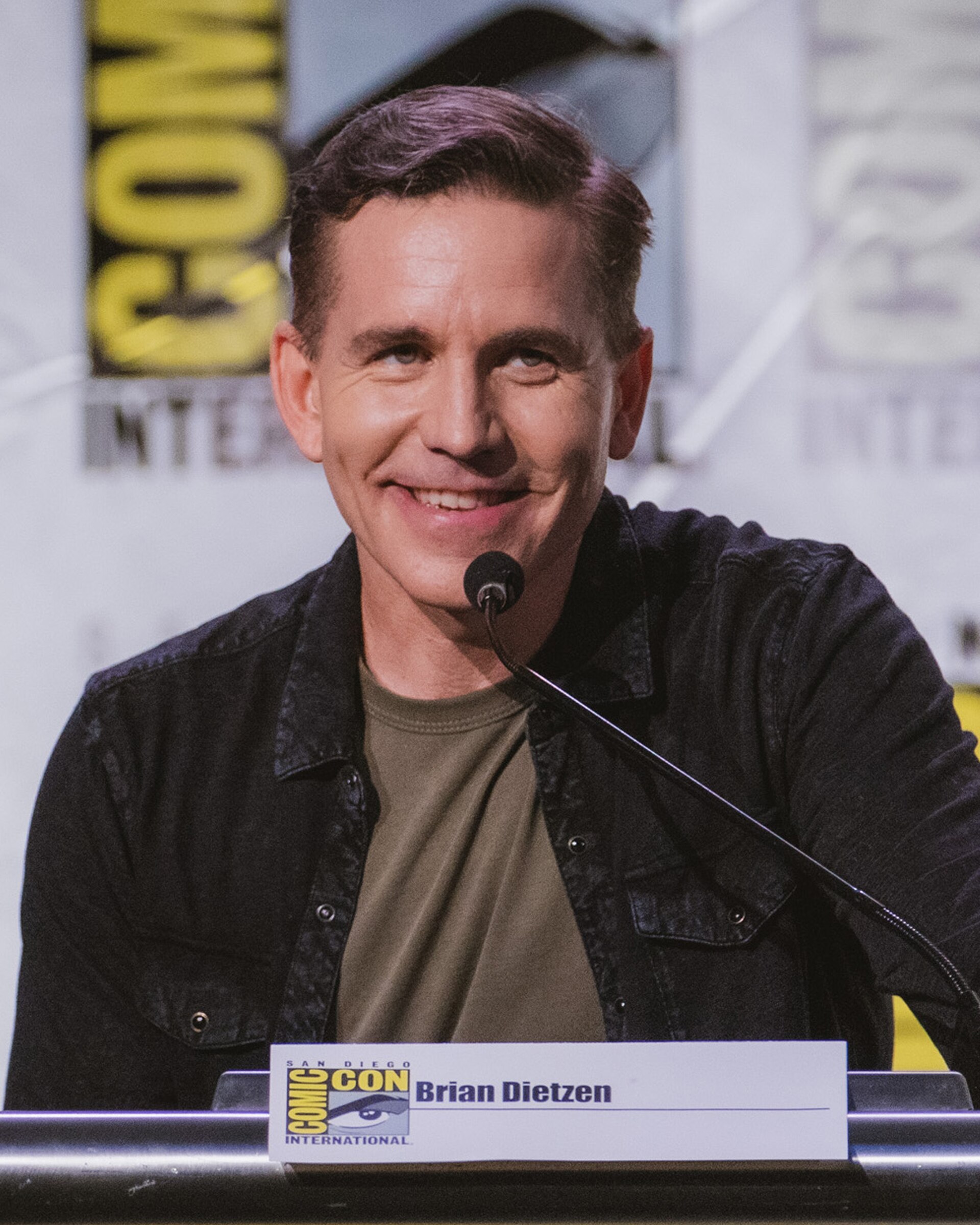 Brian Dietzen moderating a panel for NCIS: Tony & Ziva at San Diego Comic-Con 2025.