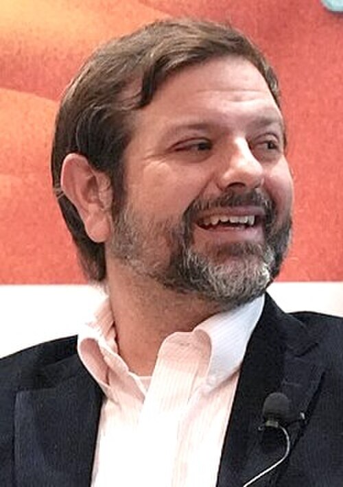 Cameron Freburg, Austin Energy, panel at SXSW 2025 in Austin, Texas. How to Build Out a City EV Charging Network.