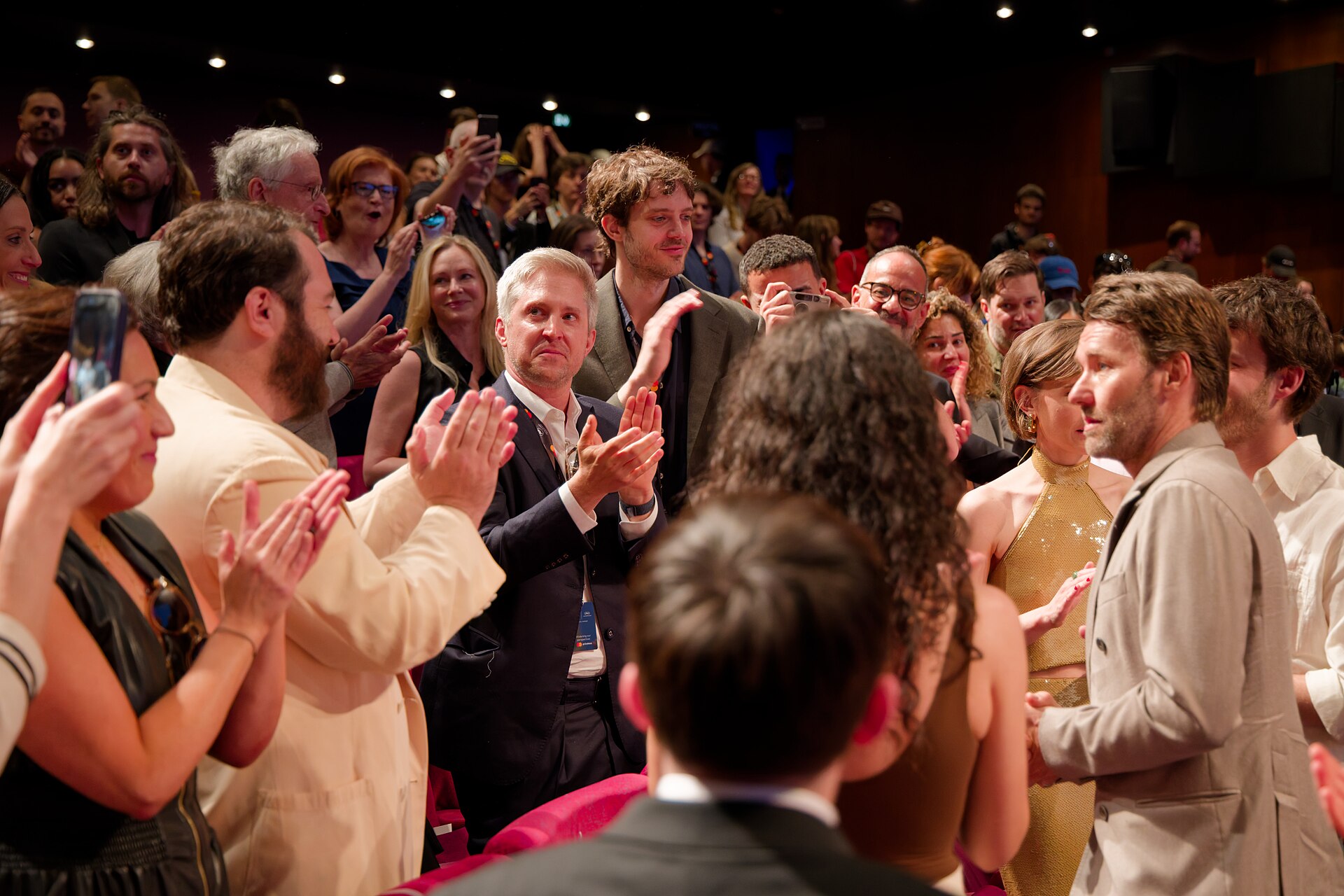 Cast and crew during the standing ovation at the 2025 Cannes Film Festival premiere of The Plague.