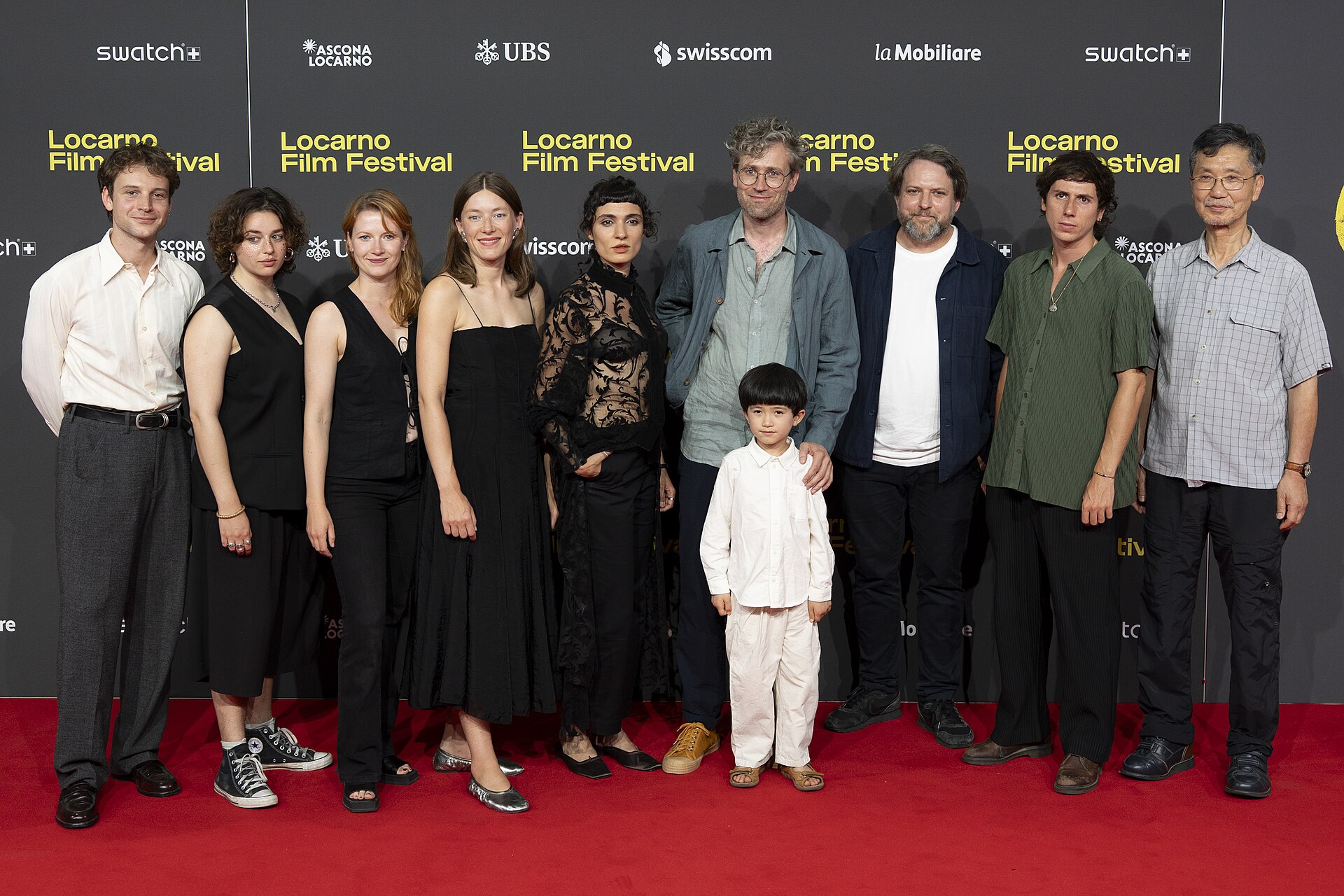Director Julian Radlmaier with cast and crew at the 78th Locarno Film Festival red carpet for Sehnsucht in Sangerhausen