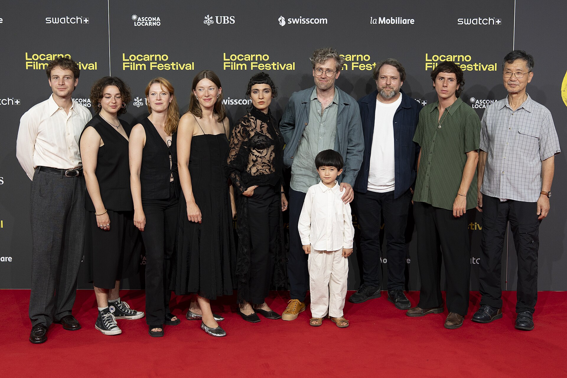 Director Julian Radlmaier with cast and crew at the 78th Locarno Film Festival red carpet for Sehnsucht in Sangerhausen