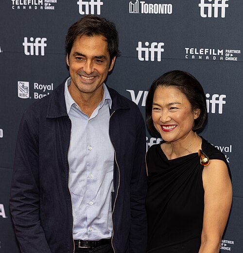 Charles Gillibert and Zhang Xin, producers, at the 2025 Toronto International Film Festival (TIFF) for the movie Couture.