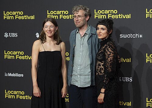 Actress Clara Schwinning, director Julian Radlmaier and actress Maral Keshavarz at the 78th Locarno Film Festival red carpet for Sehnsucht in Sangerhausen