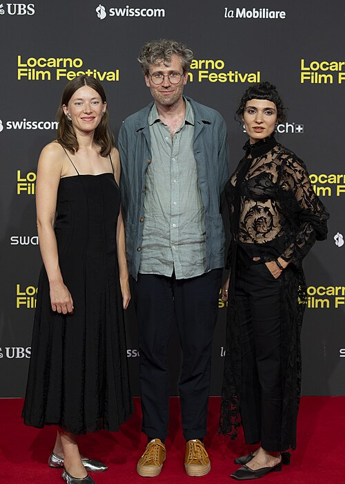 Actress Clara Schwinning, director Julian Radlmaier and actress Maral Keshavarz at the 78th Locarno Film Festival red carpet for Sehnsucht in Sangerhausen