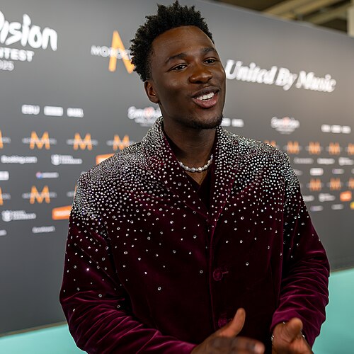 Claude, representing Netherlands, being interviewed at Eurovision 2025 in Basel, Switzerland.