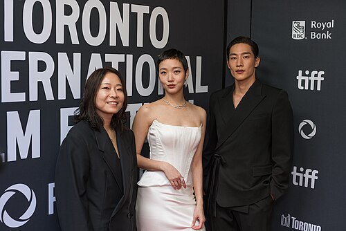 E.oni, Kim Go-eun, and Steve Sanghyun Noh at the 2024 Toronto International Film Festival red carpet for the film 'Love in the Big City'