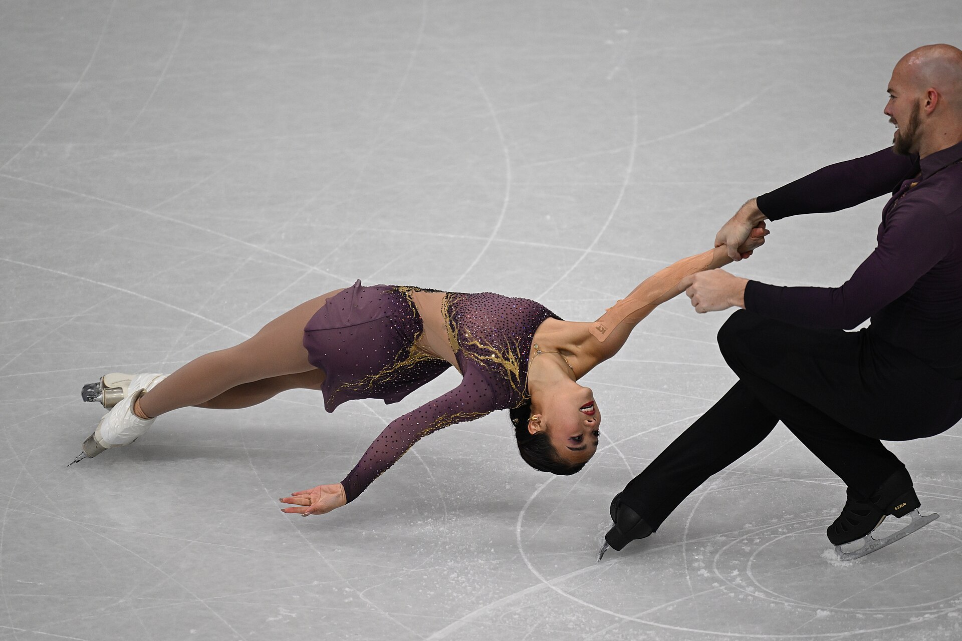 MILAN, ITALY - 15 FEBRUARY 2026: Ellie Kam and Danny O'Shea of United States compete during the Figure Skating Pair Skating Short Program at the Olympic Winter Games Milano Cortina 2026 Milano Ice Skating Arena on February 15, 2026 in Milan, Italy