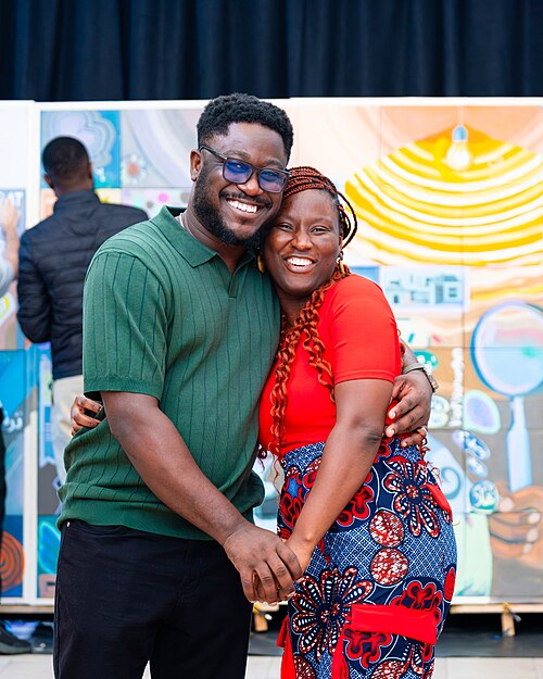 A Photo of Felix Nartey and Jael Boateng at Wikimania 2025 during the poster session