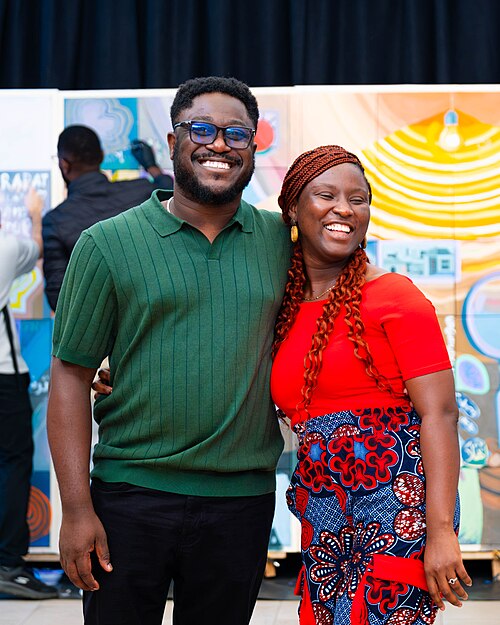 A Photo of Felix Nartey and Jael Boateng at Wikimania 2025 during the poster session