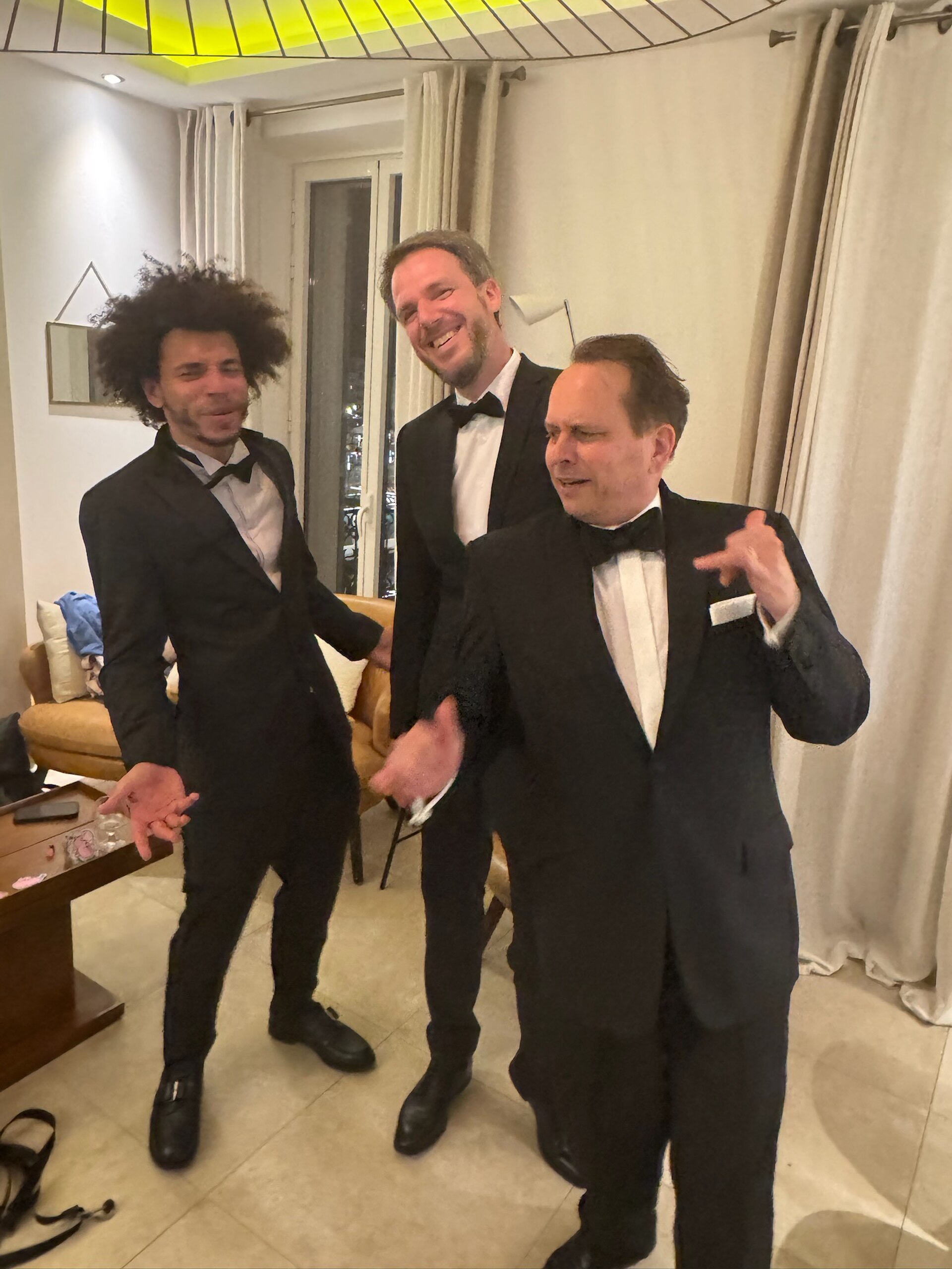 WikiPortraits photographers Gabe Hutchinson, Martin Kraft, Harald Krichel in tuxedos at Cannes Film Festival 2025