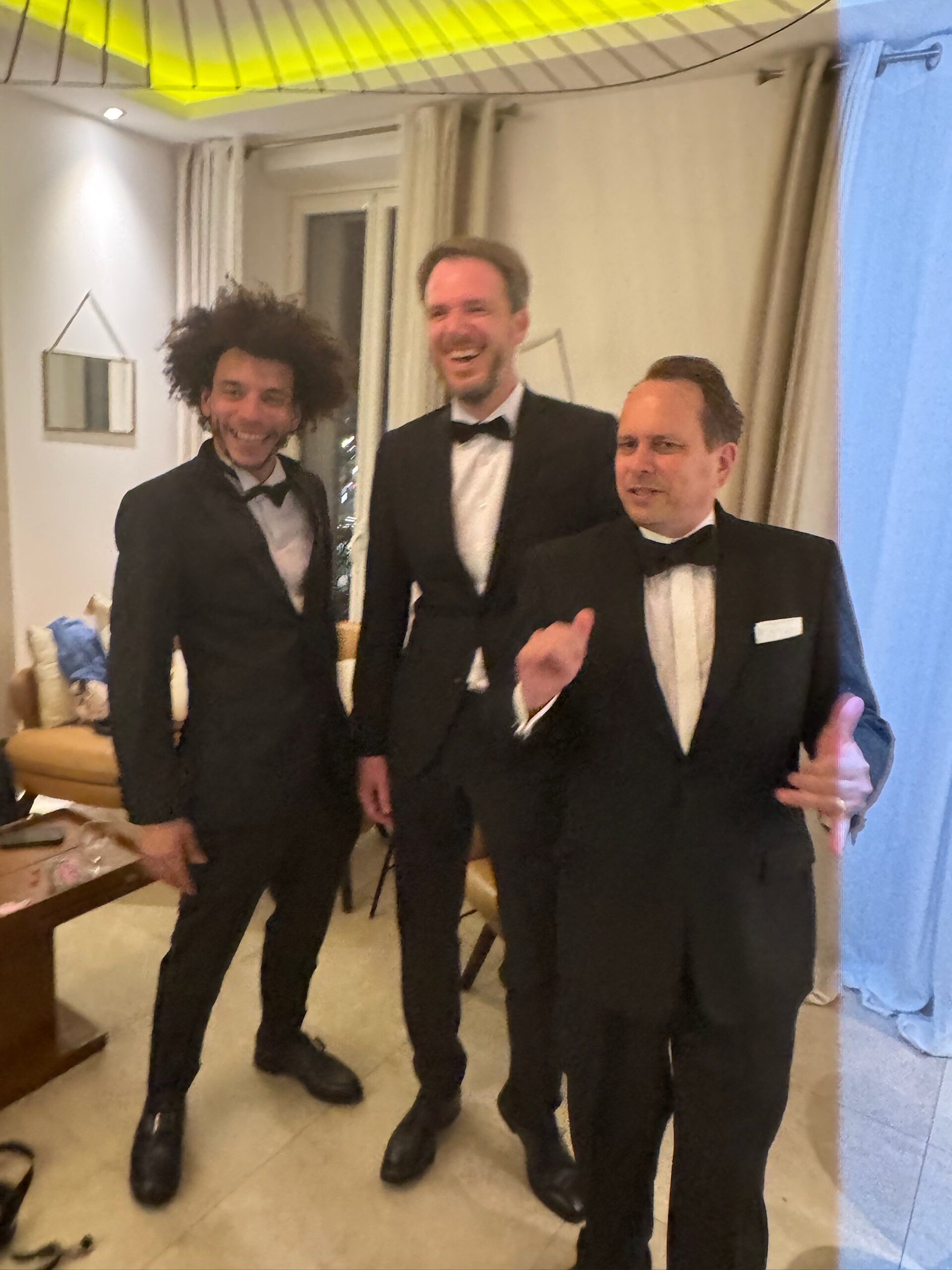 WikiPortraits photographers Gabe Hutchinson, Martin Kraft, Harald Krichel in tuxedos at Cannes Film Festival 2025