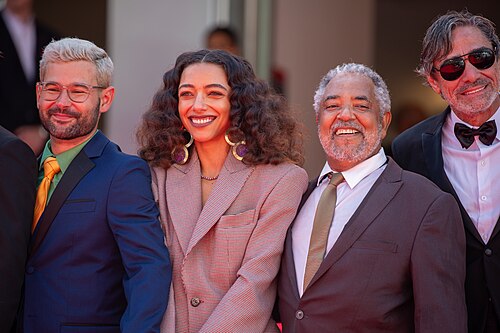 Guest, Alice Carvalho, Carlos Francisco, and Roney Villela at 2025 Cannes Red Carpet for O Agente Secreto