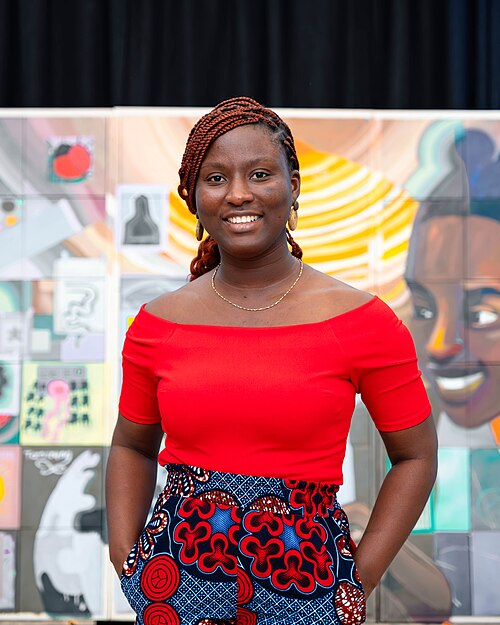 A Photo of Jael Boateng at Wikimania 2025 during the poster session