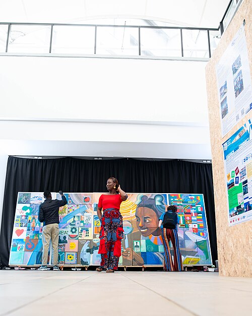 A Photo of Jael Boateng at Wikimania 2025 during the poster session