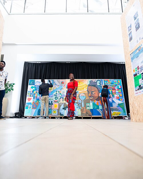 A Photo of Jael Boateng at Wikimania 2025 during the poster session
