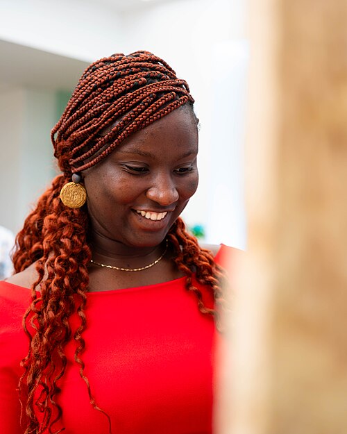 A Photo of Jael Boateng at Wikimania 2025 during the poster session