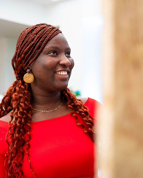 A Photo of Jael Boateng at Wikimania 2025 during the poster session