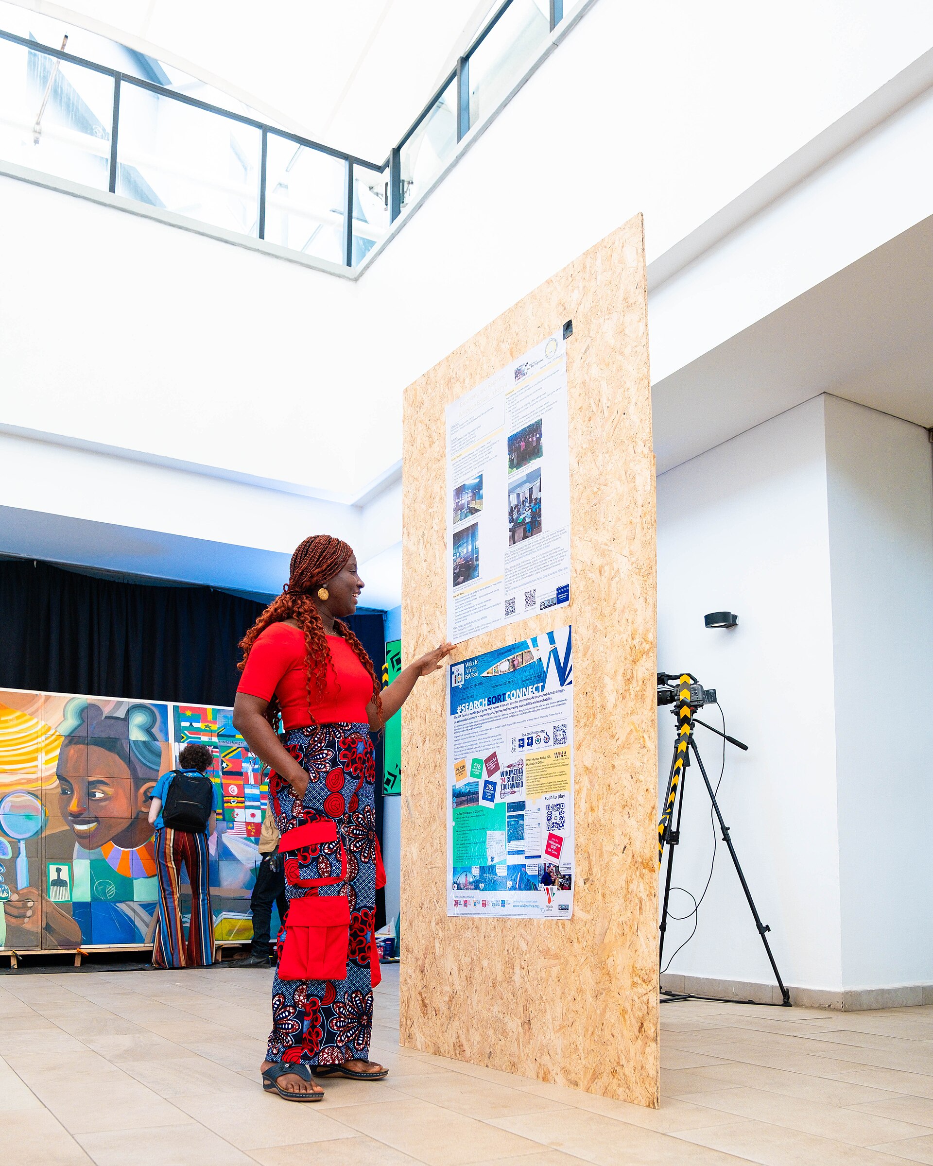 A Photo of Jael Boateng at Wikimania 2025 during the poster session