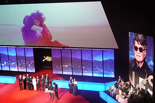 Director Jafar Panahi accepting Palme d'Or for Un Simple Accident at Cannes 2025
