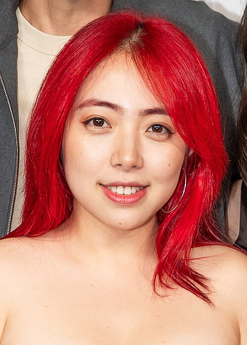 Jiayi Li at a 2025 Tribeca Film Festival red carpet in New York City for the Floating Roots Shorts Program.