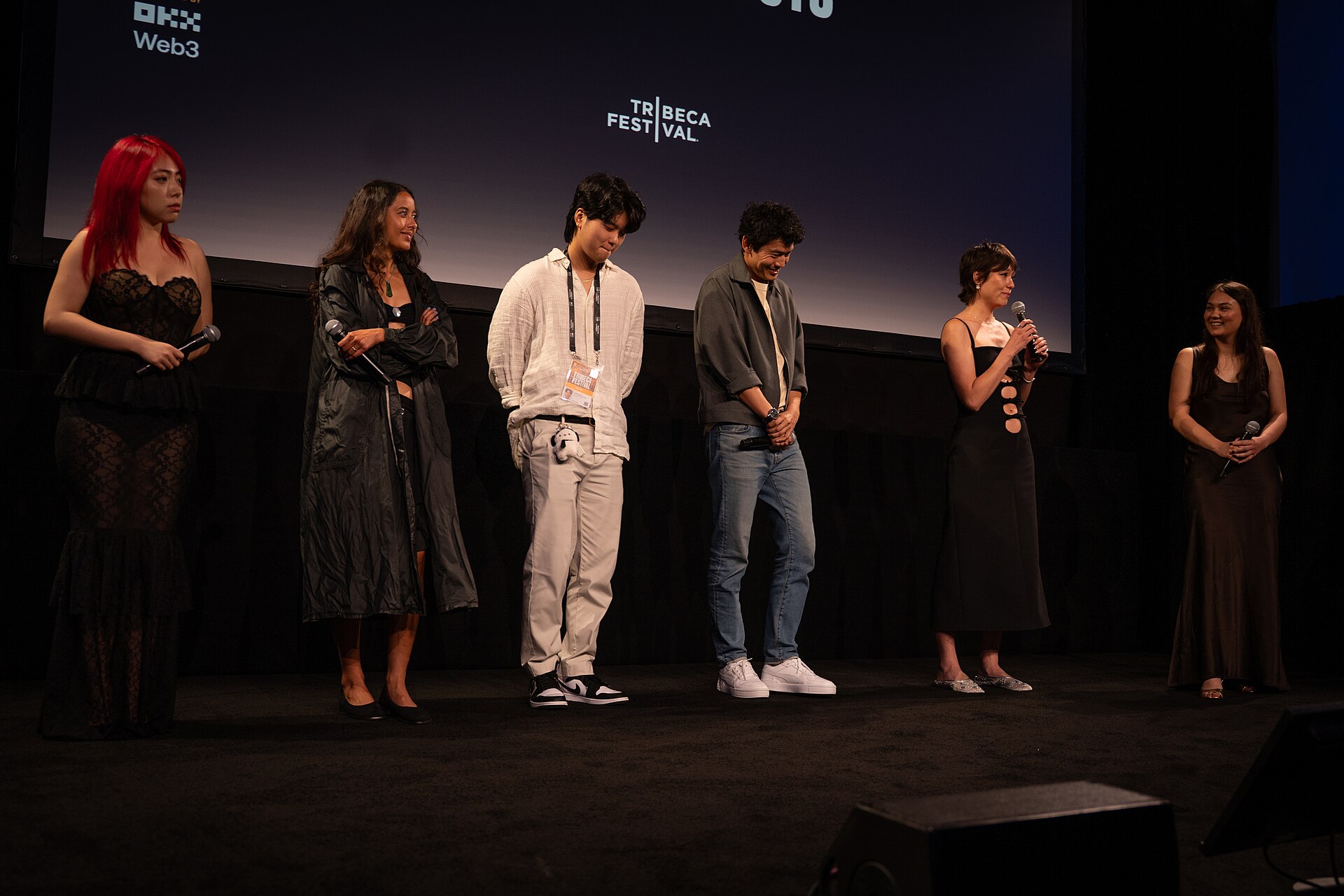 Jiayi Li, Ira Hetaraka, Kevin Jin Kwan Kim, Frank Sun, Chelsie Pennello, and Olivia Owyeung at a 2025 Tribeca Film Festival red carpet in New York City for the film Floating Roots Shorts Program.