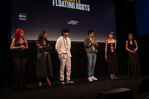 Jiayi Li, Ira Hetaraka, Kevin Jin Kwan Kim, Frank Sun, Chelsie Pennello, and Olivia Owyeung at a 2025 Tribeca Film Festival red carpet in New York City for the film Floating Roots Shorts Program.