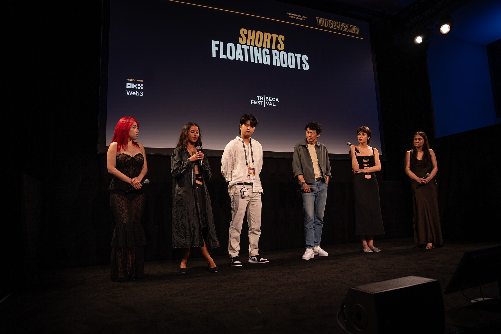 Jiayi Li, Ira Hetaraka, Kevin Jin Kwan Kim, Frank Sun, Chelsie Pennello, and Olivia Owyeung at a 2025 Tribeca Film Festival red carpet in New York City for the film Floating Roots Shorts Program.