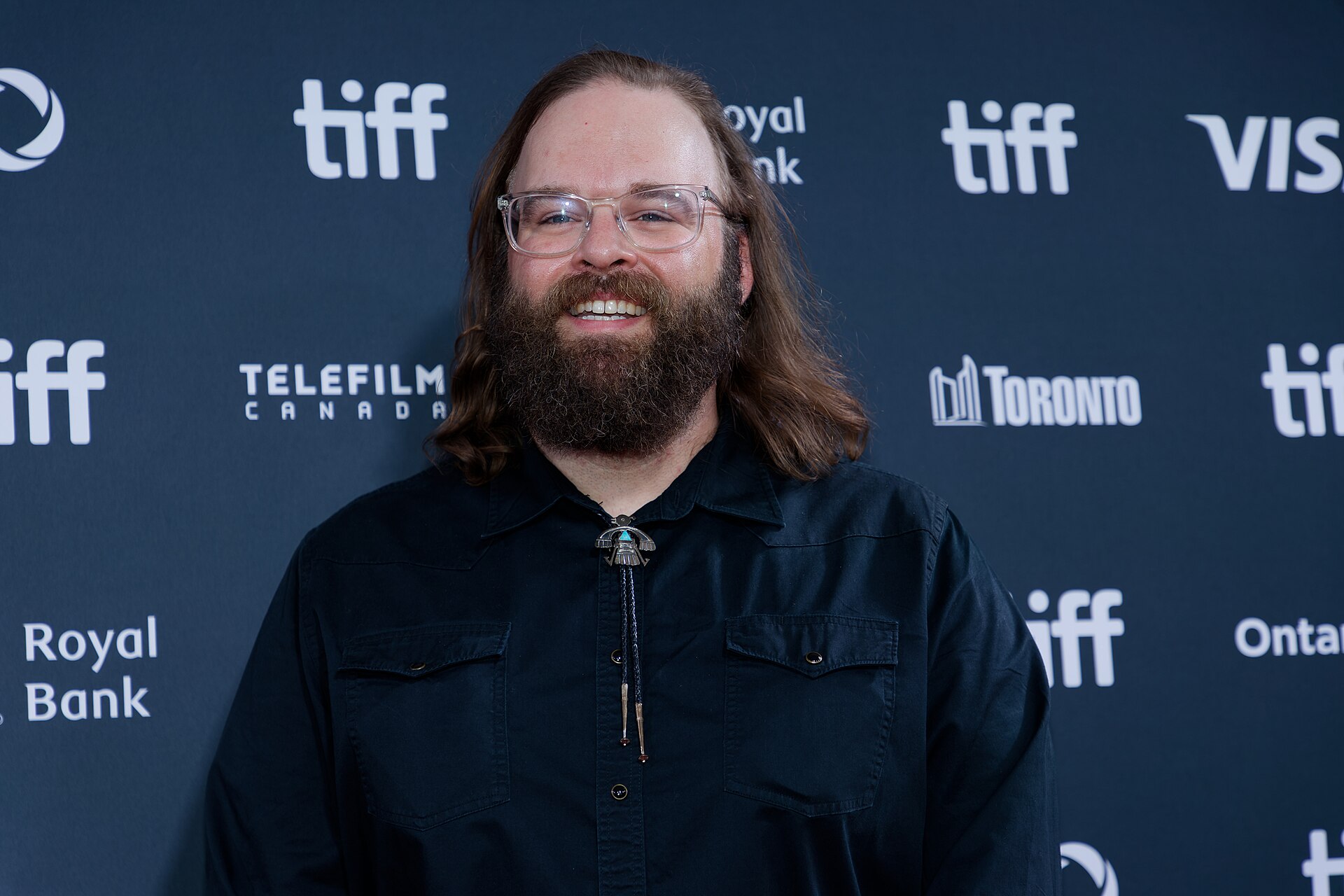 John Lang at the 2024 Toronto International Film Festival (TIFF) for the movie Takin' Care of Business.
