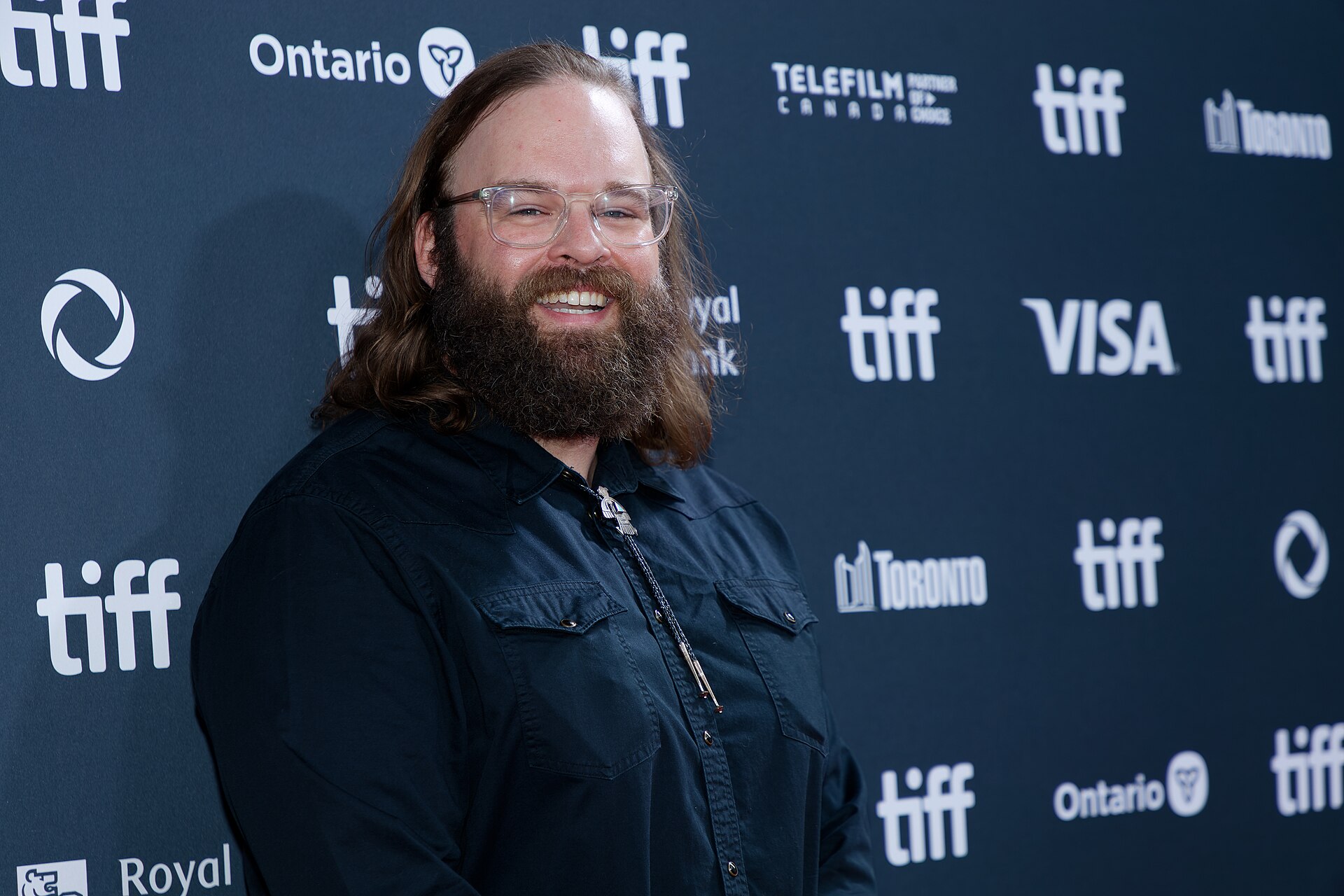 John Lang at the 2024 Toronto International Film Festival (TIFF) for the movie Takin' Care of Business.