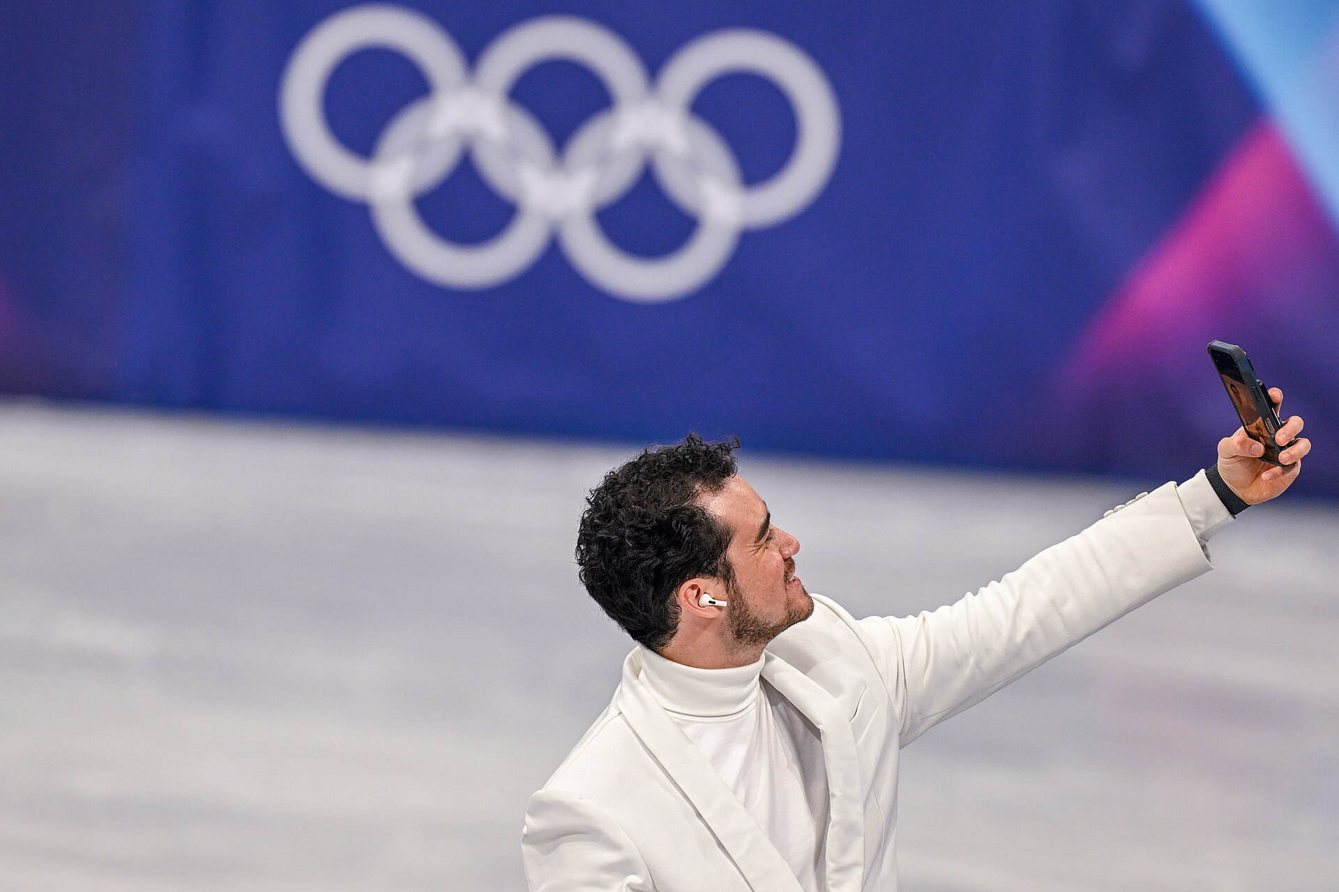 MILAN, ITALY - FEBRUARY 19: Camera man Jordan Cowan doing selfie after the medal ceremony of the Women's Single Skating on day thirteen of the Milano Cortina 2026 Winter Olympic games at Milano Ice Skating Arena on February 19, 2026 in Milan, Italy.