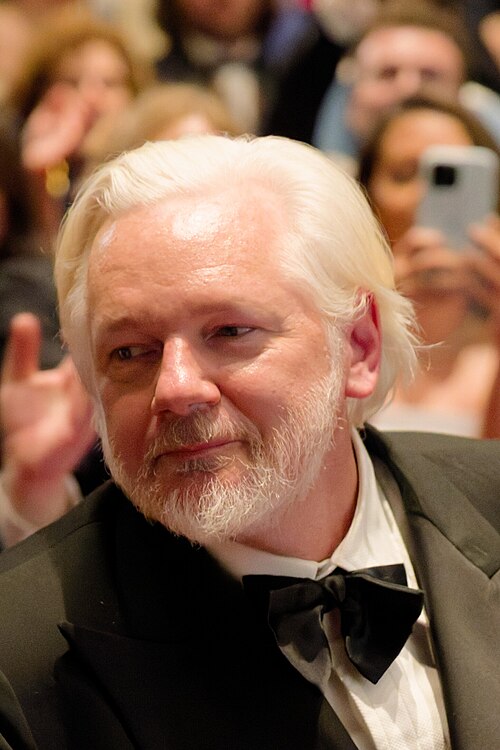 Julian Assange in the audience after the premiere of The Six Billion Dollar Man at the 2025 Cannes Film Festival